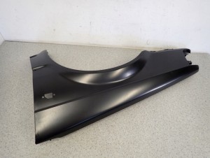 MAZDA 323 BF 85-87 BŁOTNIK PRZEDNI LEWY 4/5 MINIATURA