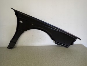 NISSAN SUNNY B12 KOMBI SEDAN 86-88 BŁOTNIK PRZEDNI LEWY NOWY 10/10 MINIATURA