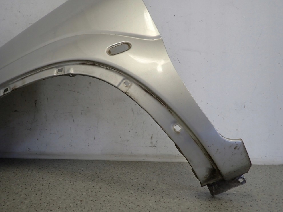 SUZUKI IGNIS I 00-03 BŁOTNIK PRZEDNI LEWY Z2S 3/14