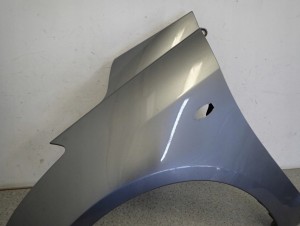 SUZUKI SWIFT MK7 10-16 BŁOTNIK PRZEDNI LEWY ZCD 5/11 MINIATURA