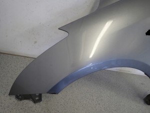 SUZUKI SWIFT MK7 10-16 BŁOTNIK PRZEDNI LEWY ZCD 6/11 MINIATURA