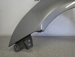 SUZUKI SWIFT MK7 10-16 BŁOTNIK PRZEDNI LEWY ZCD 7/11 MINIATURA