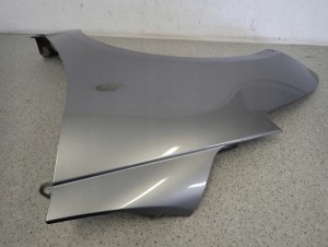 SUZUKI SWIFT MK7 10-16 BŁOTNIK PRZEDNI LEWY ZCD 9/11 MINIATURA