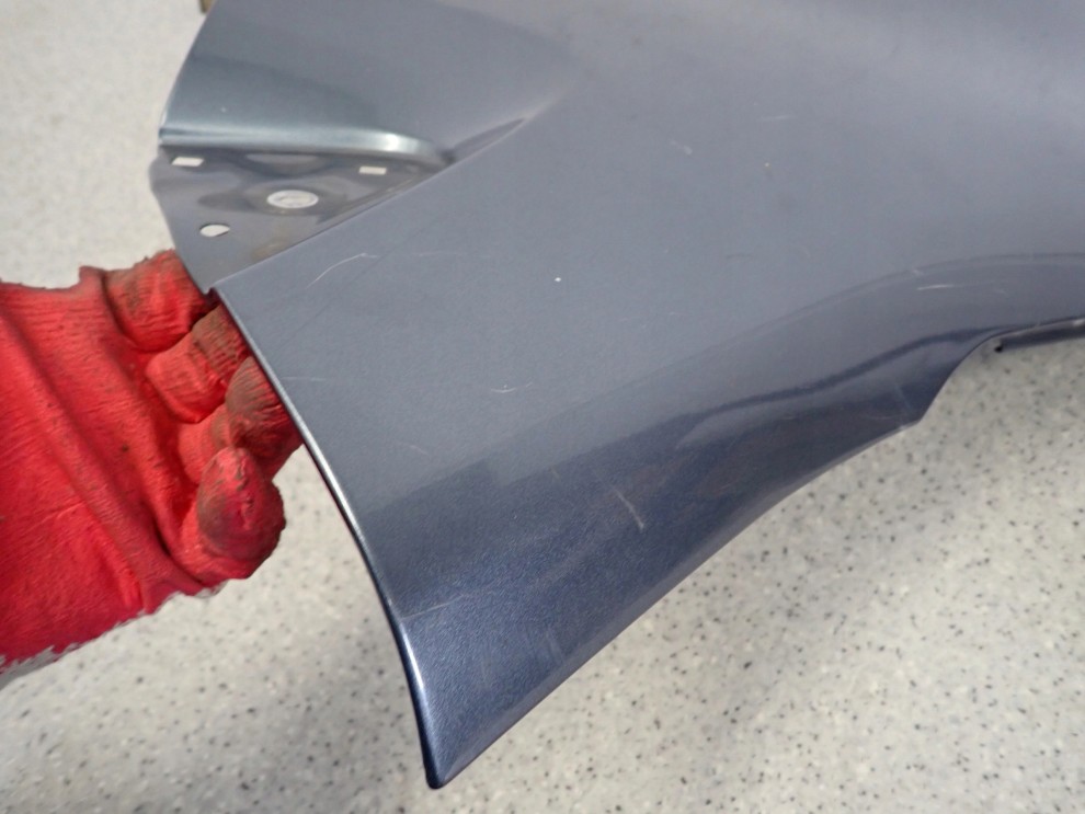 SUZUKI ALTO NISSAN PIXO 09-14 BŁOTNIK PRZEDNI LEWY ZY4 11/12