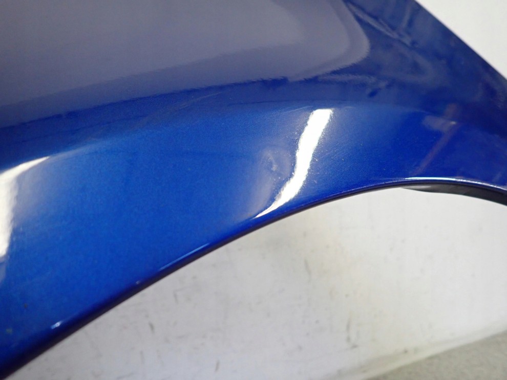 SUZUKI SWIFT MK7 10-16 BŁOTNIK PRZEDNI LEWY ZCG 4/9