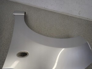 SUZUKI ALTO NISSAN PIXO 09-14 BŁOTNIK PRZEDNI LEWY Z2S 7/9 MINIATURA