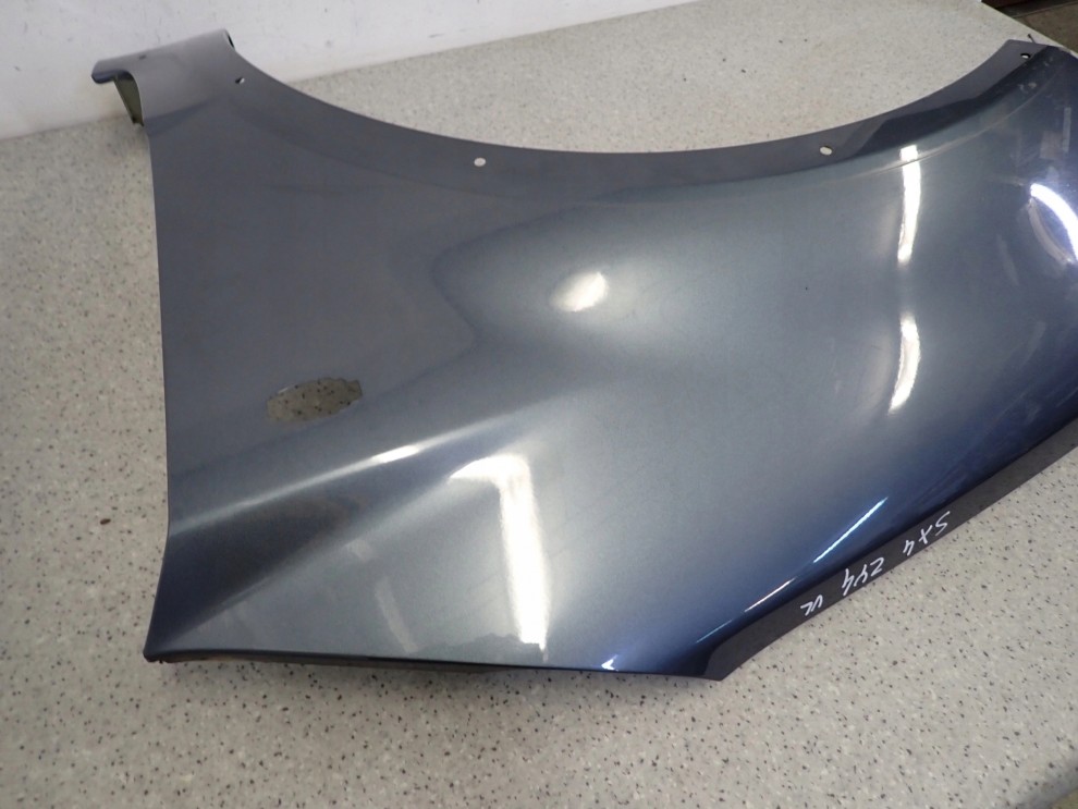 SUZUKI SX4 06-12 BŁOTNIK PRZEDNI LEWY ZY4 9/12