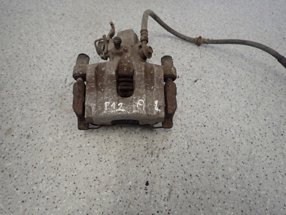 PRIMERA P12 02-07 ZACISK HAMULCOWY TYLNY LEWY 1/6