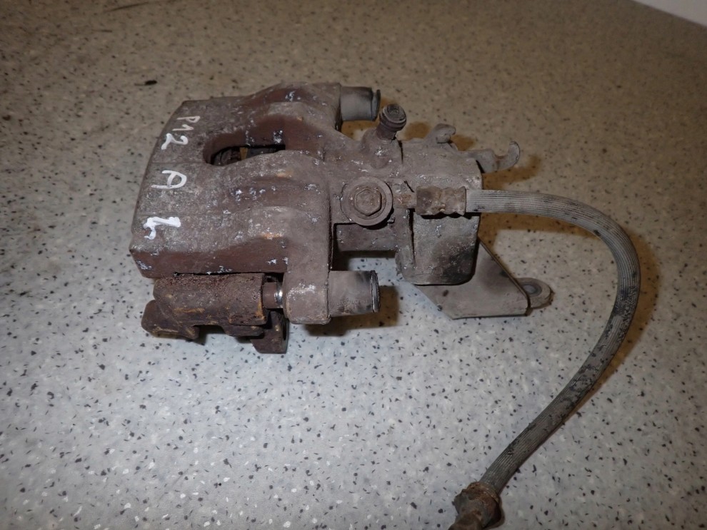 PRIMERA P12 02-07 ZACISK HAMULCOWY TYLNY LEWY 4/6