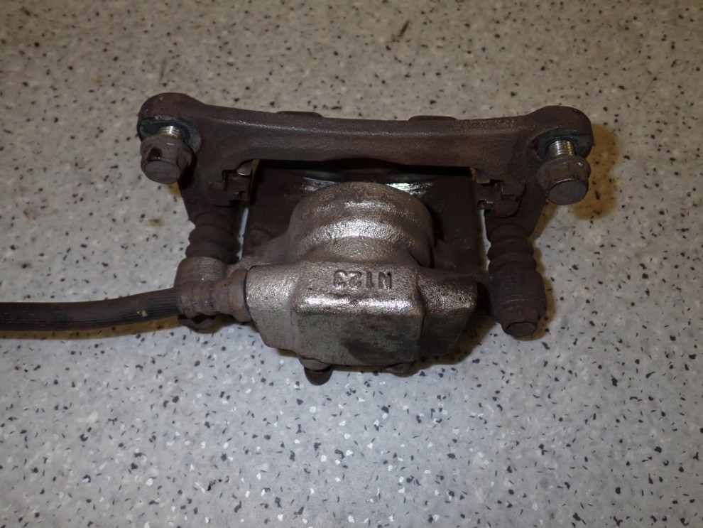 MITSUBISHI GRANDIS 03-11 ZACISK HAMULCOWY TYLNY LEWY 6/6