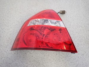 CHEVROLET AVEO T250 4D 07- LAMPA TYLNA LEWA 3/8 MINIATURA