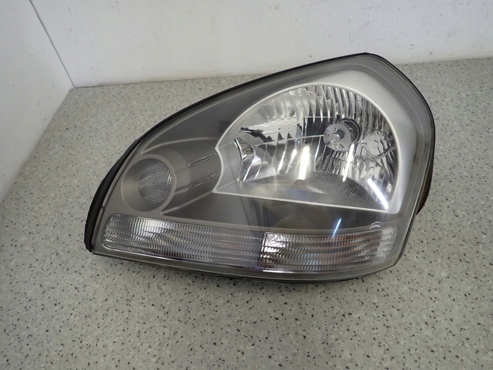 HYUNDAI TUCSON 04-10 REFLEKTOR LEWY LAMPA PRZEDNIA 4/8