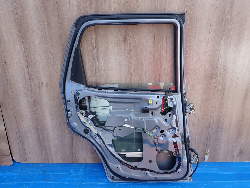 SUZUKI IGNIS 04-07 DRZWI TYLNE LEWE ZCD 8/9