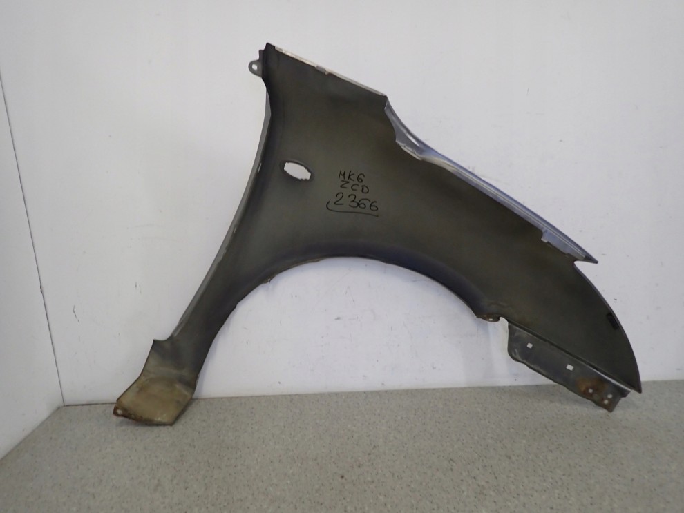 SUZUKI SWIFT MK6 05-09 BŁOTNIK PRZEDNI LEWY ZCD 11/12