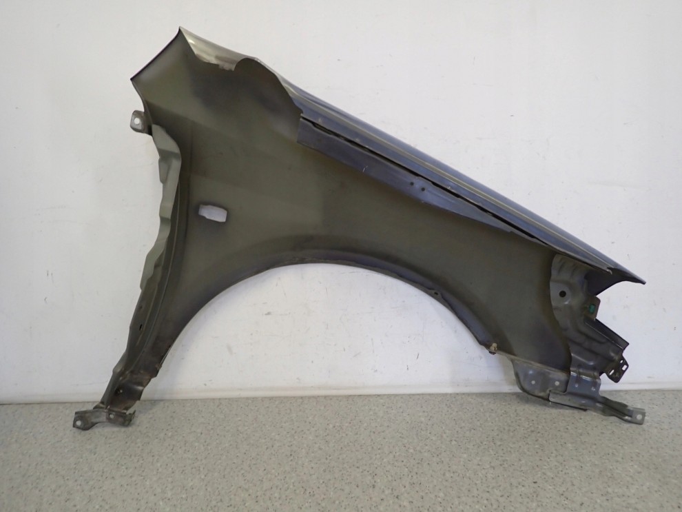 NISSAN PRIMERA P12 02-07 BŁOTNIK PRZEDNI LEWY K30 10/11