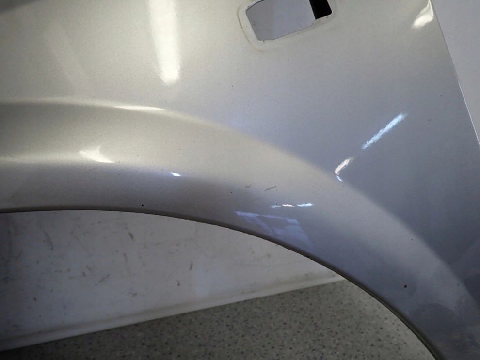 NISSAN PRIMERA P12 02-07 BŁOTNIK PRZEDNI LEWY KY0 2/14