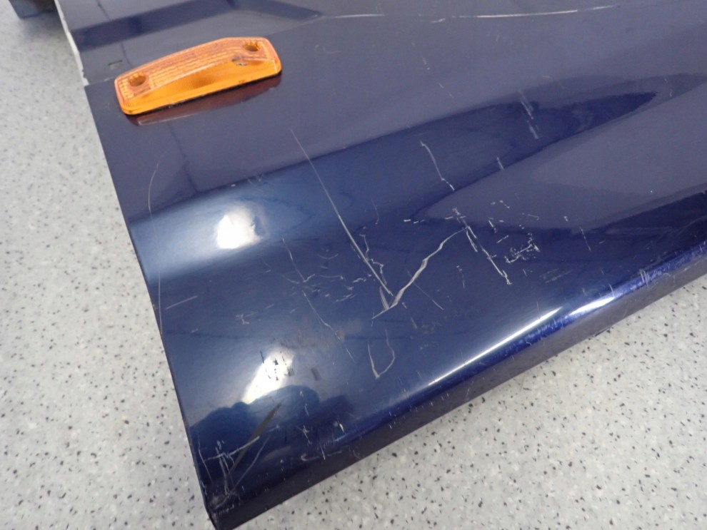 SSANGYONG MUSSO 95- BŁOTNIK PRZEDNI LEWY 11/16