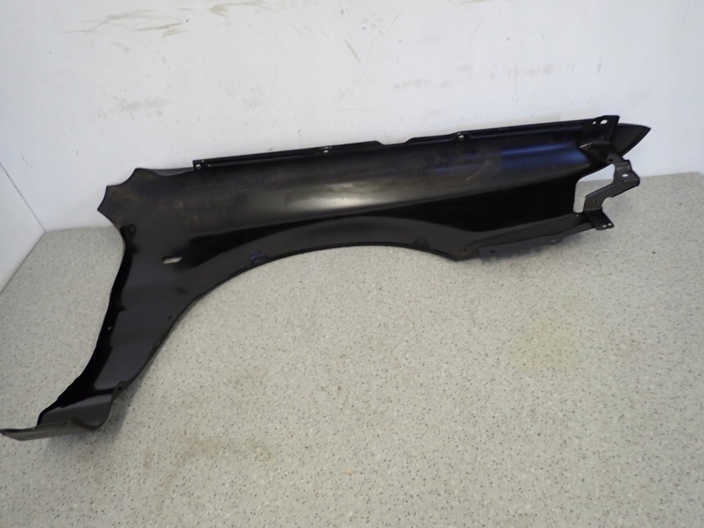 MITSUBISHI GALANT 88-92 BŁOTNIK PRZEDNI LEWY NOWY ORYGINAŁ 9/15