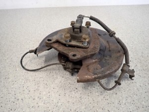 KIA VENGA 09- TARCZA KOTWICZNA ZWROTNICA TYLNA LEWA 5/5 MINIATURA